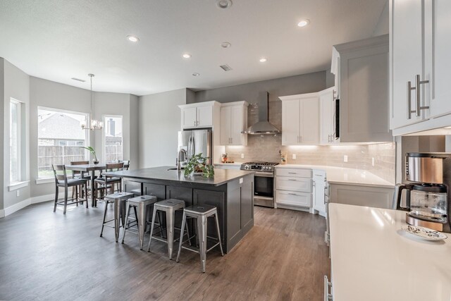 804 Shirley Jean Ln, Collinsville, TX 76233 - kitchen with wall chimney exhaust hood, stainless steel appliances, a chandelier, light wood finished floors, and recessed lighting