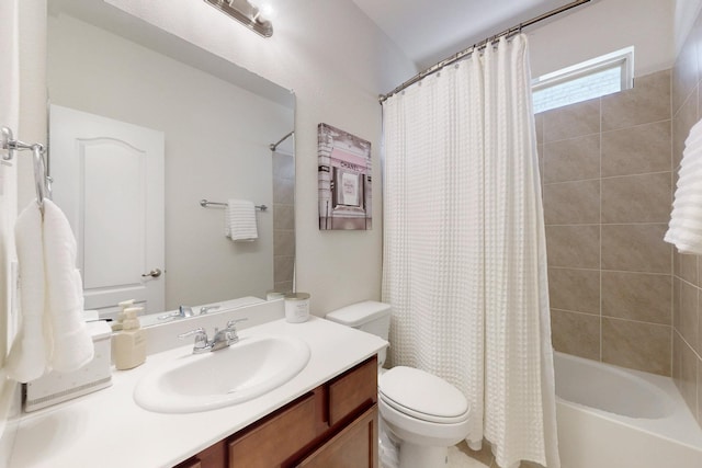 bathroom featuring shower / bath combo with shower curtain, toilet, and vanity