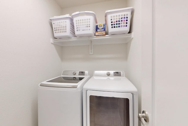 laundry room featuring washing machine and dryer and laundry area