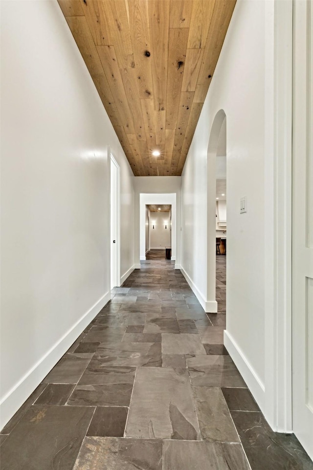 137 Ambrosia Ln, Heath, TX 75032 - corridor featuring wood ceiling, arched walkways, and baseboards