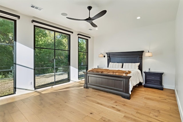 137 Ambrosia Ln, Heath, TX 75032 - bedroom with light wood-type flooring, a ceiling fan, recessed lighting, and baseboards