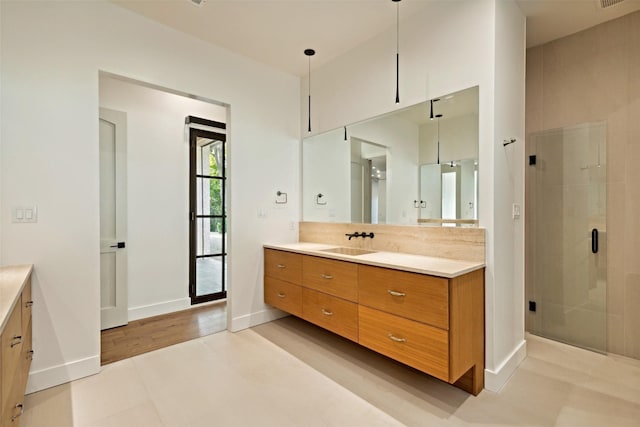 137 Ambrosia Ln, Heath, TX 75032 - bathroom featuring vanity, a shower stall, and baseboards