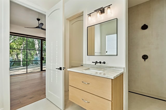 137 Ambrosia Ln, Heath, TX 75032 - bathroom with vanity, a tile shower, and ceiling fan