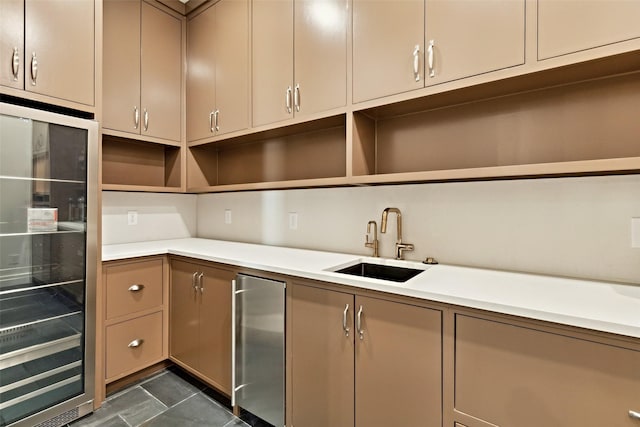 137 Ambrosia Ln, Heath, TX 75032 - kitchen featuring open shelves, beverage cooler, a sink, light countertops, and stainless steel refrigerator