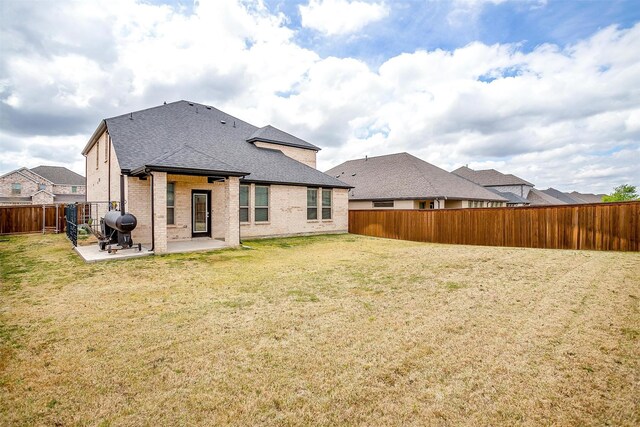10600 Barrington Ln, Fort Worth, TX 76126 - back of house with a fenced backyard, a shingled roof, a lawn, and a patio area