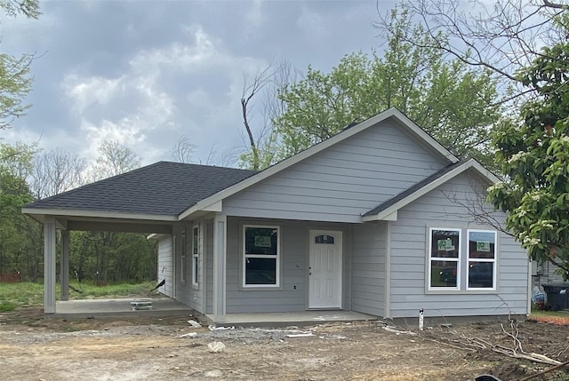 view of front of home featuring a shingled roof