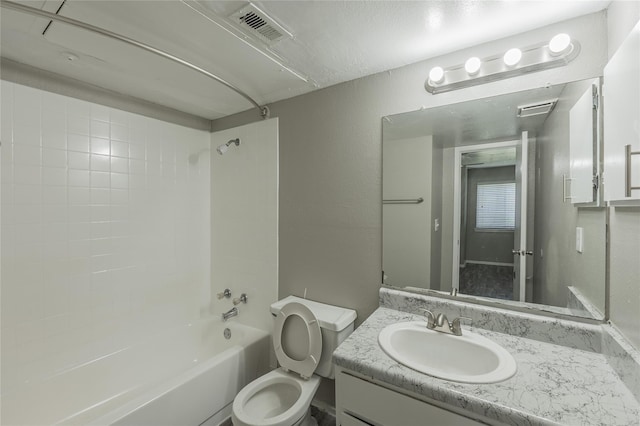 1122 Millview Dr Unit 2702, Arlington, TX 76012 - bathroom with vanity, toilet, a textured wall, visible vents, and  shower combination
