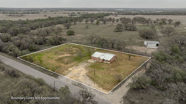 birds eye view of property featuring a rural view