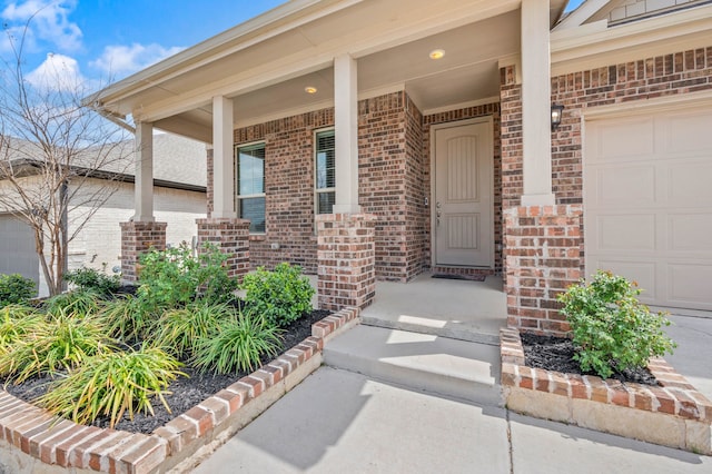 5312 Waterview Ct, Haltom City, TX 76137 - doorway to property with brick siding, a porch, and an attached garage