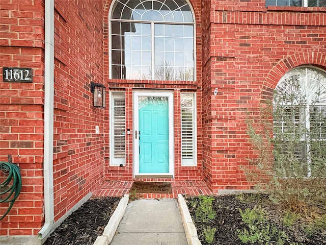 tiled entrance foyer with stairs, a towering ceiling, baseboards, and visible vents