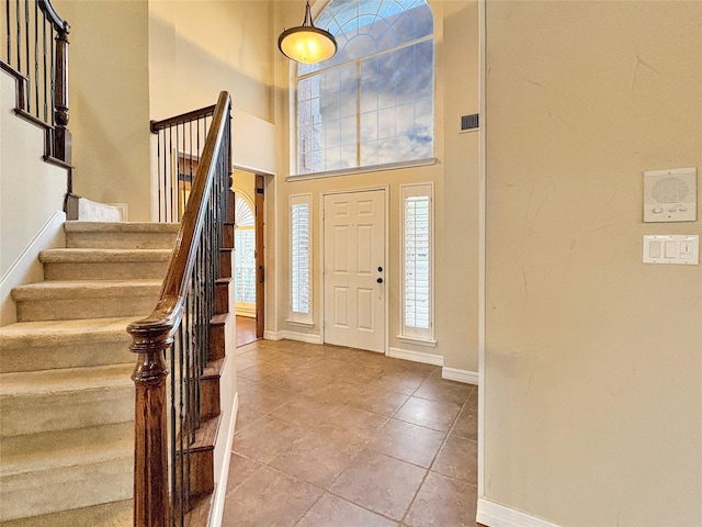 spare room with a textured ceiling, wood finished floors, a ceiling fan, and baseboards
