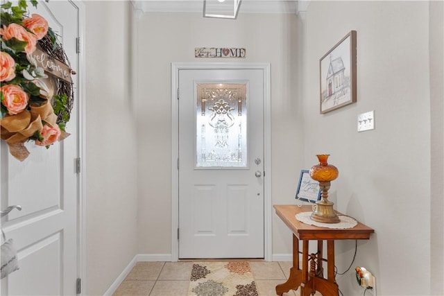 foyer entrance with light tile patterned flooring, baseboards, and ornamental molding