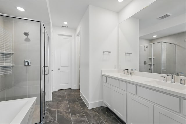 2836 Holland Ct, Celina, TX 75009 - bathroom featuring baseboards, visible vents, a stall shower, and a sink