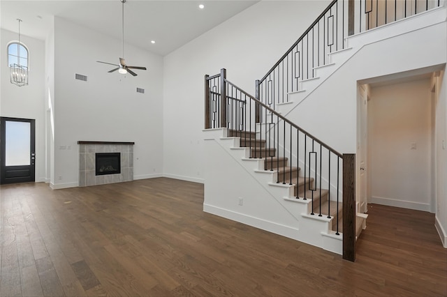 2836 Holland Ct, Celina, TX 75009 - staircase featuring high vaulted ceiling, ceiling fan, visible vents, baseboards, and wood finished floors