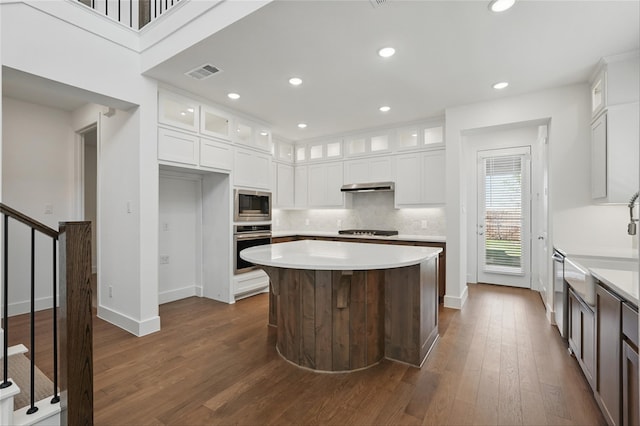 2836 Holland Ct, Celina, TX 75009 - kitchen featuring a kitchen breakfast bar, tasteful backsplash, a sink, stainless steel appliances, and a kitchen island