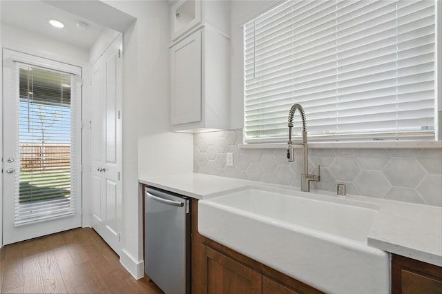 2836 Holland Ct, Celina, TX 75009 - kitchen with a sink, stainless steel appliances, a kitchen bar, tasteful backsplash, and a kitchen island