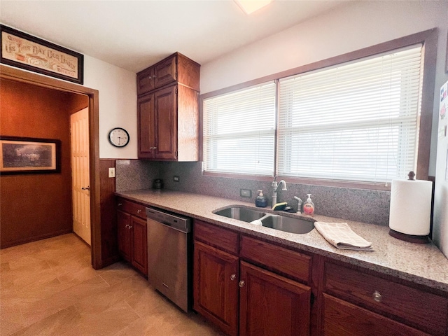 220 N 15th Ave, Munday, TX 76371 - kitchen with dishwasher, light countertops, a sink, and tasteful backsplash