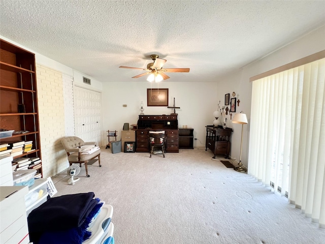 220 N 15th Ave, Munday, TX 76371 - carpeted office space featuring a textured ceiling, ceiling fan, and visible vents