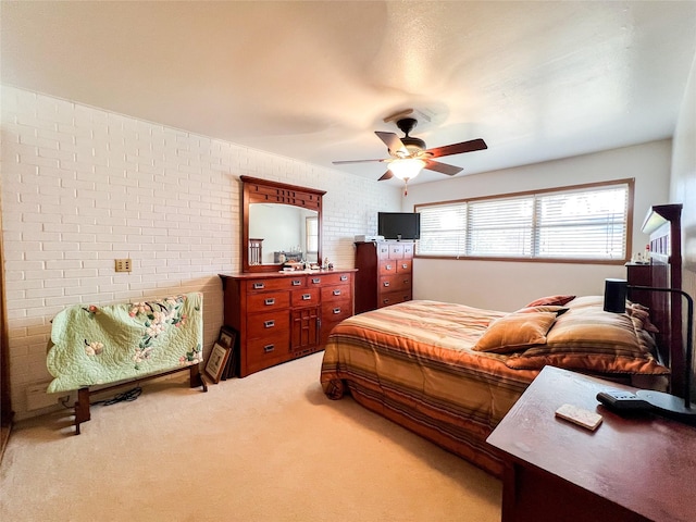 220 N 15th Ave, Munday, TX 76371 - carpeted bedroom with brick wall and ceiling fan