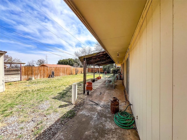 220 N 15th Ave, Munday, TX 76371 - view of yard featuring a fenced backyard and a patio area