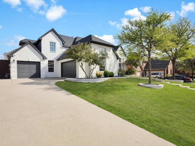 modern farmhouse with driveway, a front yard, and a garage