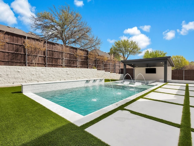 view of swimming pool featuring a patio area, a fenced backyard, and a lawn