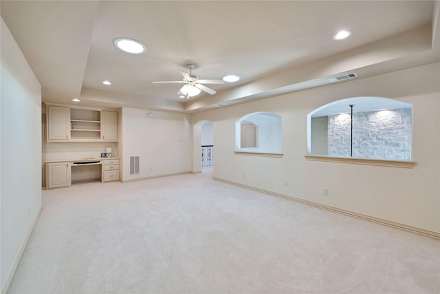 5460 Stone Canyon Dr, Frisco, TX 75034 - unfurnished living room featuring arched walkways, recessed lighting, a raised ceiling, and visible vents