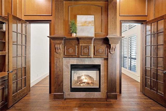 5460 Stone Canyon Dr, Frisco, TX 75034 - details featuring baseboards, french doors, and wood finished floors