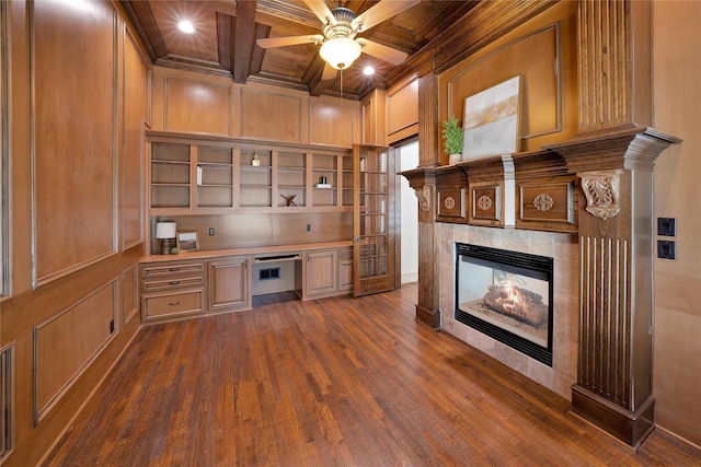 5460 Stone Canyon Dr, Frisco, TX 75034 - interior space with wood ceiling, a fireplace, a decorative wall, built in study area, and dark wood-style floors