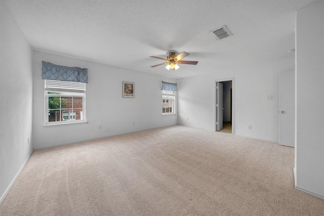 600 Carol Way, Euless, TX 76039 - carpeted spare room with a textured ceiling and ceiling fan