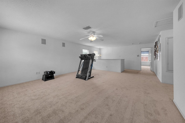 600 Carol Way, Euless, TX 76039 - workout area featuring ceiling fan, carpet, and a textured ceiling