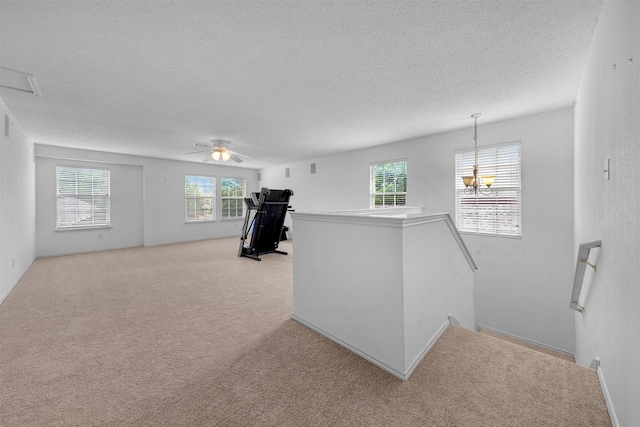 600 Carol Way, Euless, TX 76039 - hallway featuring a textured ceiling, an upstairs landing, and light carpet