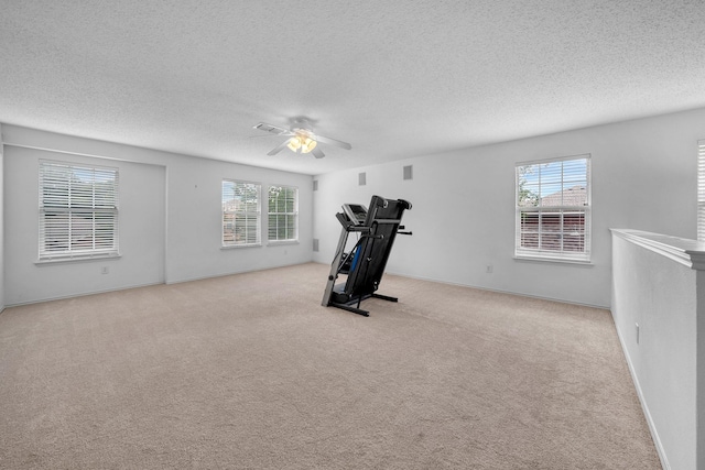 600 Carol Way, Euless, TX 76039 - exercise room with a textured ceiling, plenty of natural light, a ceiling fan, and carpet