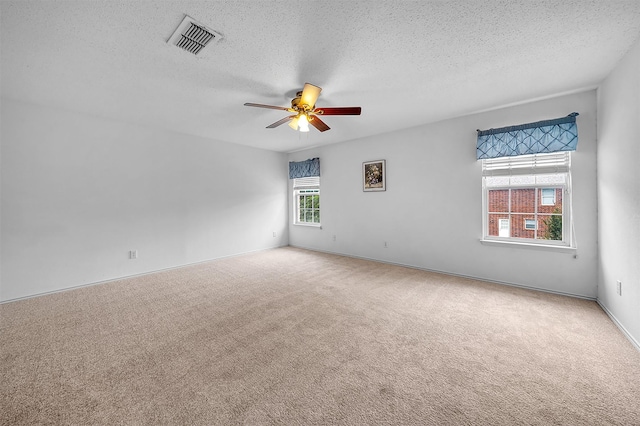 600 Carol Way, Euless, TX 76039 - unfurnished room featuring carpet flooring, a ceiling fan, and a textured ceiling