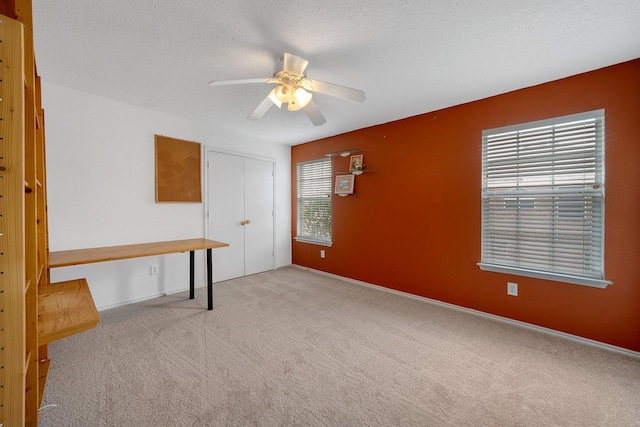 600 Carol Way, Euless, TX 76039 - empty room featuring carpet floors, a ceiling fan, and a textured ceiling