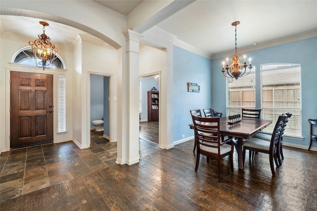 5218 Pueblo Ln, Frisco, TX 75034 - dining space featuring a chandelier, baseboards, ornamental molding, arched walkways, and decorative columns
