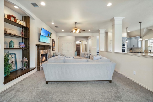 5218 Pueblo Ln, Frisco, TX 75034 - living area with light colored carpet, ceiling fan, recessed lighting, and a fireplace