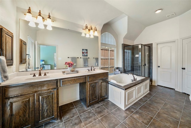 5218 Pueblo Ln, Frisco, TX 75034 - full bathroom with a stall shower, vaulted ceiling, a garden tub, tile patterned floors, and double vanity