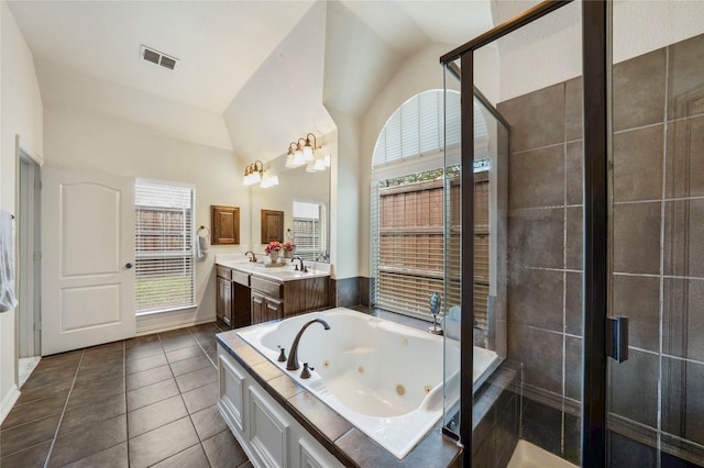 5218 Pueblo Ln, Frisco, TX 75034 - bathroom featuring a shower stall, vaulted ceiling, tile patterned floors, vanity, and a tub with jets