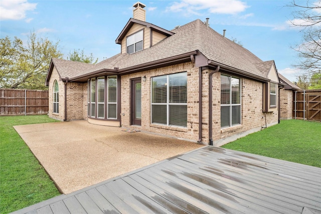 5218 Pueblo Ln, Frisco, TX 75034 - rear view of house featuring brick siding, roof with shingles, a chimney, and a wooden deck