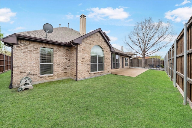 5218 Pueblo Ln, Frisco, TX 75034 - rear view of property featuring a chimney, brick siding, roof with shingles, and a patio area
