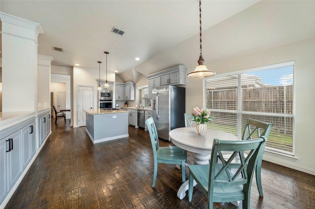 5218 Pueblo Ln, Frisco, TX 75034 - dining area with dark wood-style flooring, lofted ceiling, baseboards, and recessed lighting