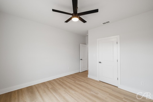 6817 Beals Creek Dr, Abilene, TX 79606 - empty room with a tray ceiling, baseboards, and a ceiling fan