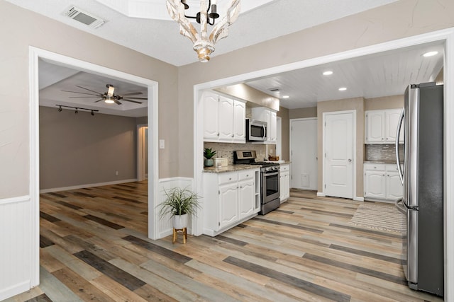 kitchen featuring white cabinetry, light wood-type flooring, recessed lighting, visible vents, and appliances with stainless steel finishes