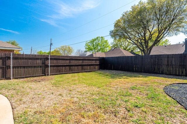 view of yard featuring a fenced backyard