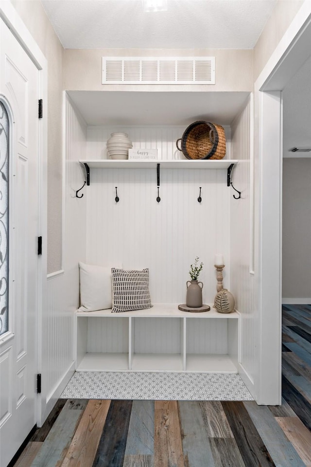 mudroom with visible vents and wood finished floors