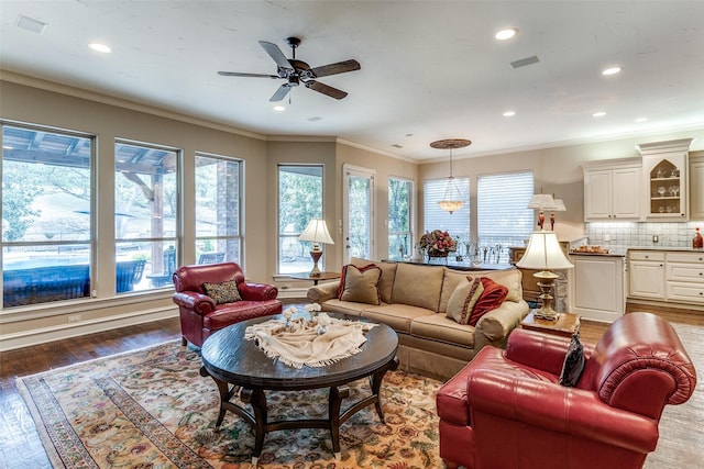 4592 Biltmoore Dr, Frisco, TX 75034 - living room featuring crown molding, ceiling fan, recessed lighting, and wood finished floors