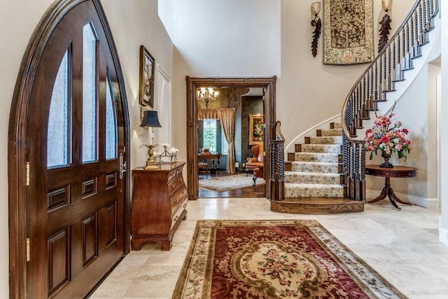 4592 Biltmoore Dr, Frisco, TX 75034 - entrance foyer featuring stairs, a towering ceiling, and baseboards