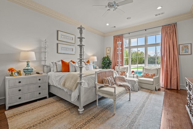 bedroom featuring visible vents, recessed lighting, wood finished floors, and ornamental molding