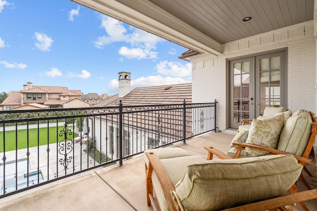 balcony featuring french doors